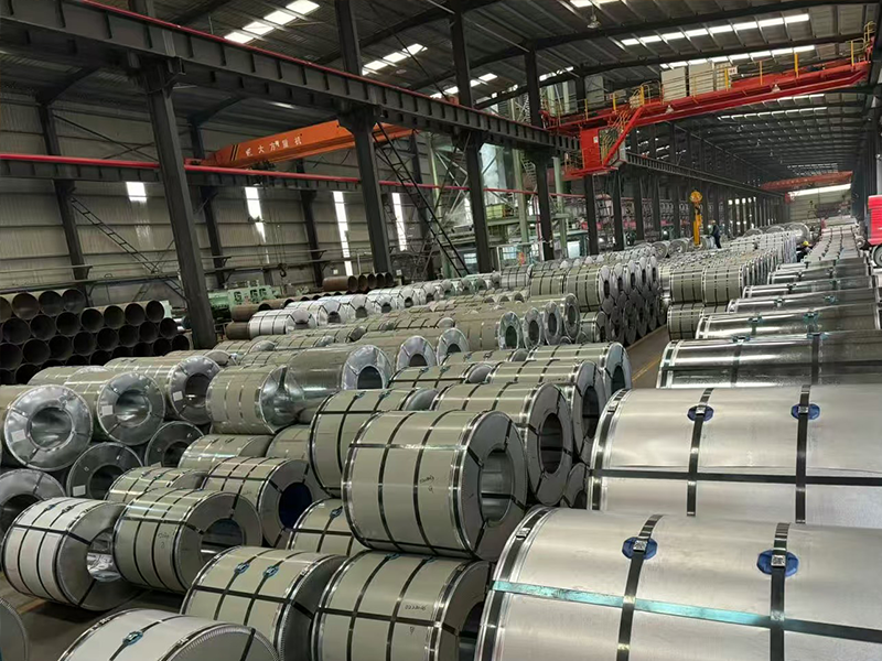 The galvanized coils are neatly stored in the warehouse picture